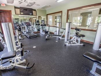 A fitness center with treadmills and other exercise equipment